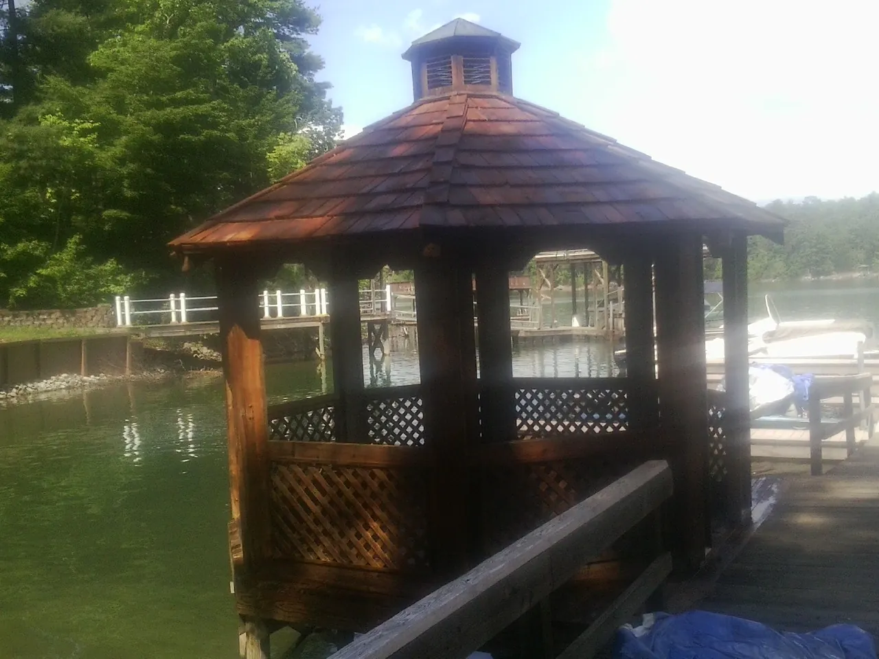 Cedar shake gazebo roof rebuilt on a lake dock in Venice